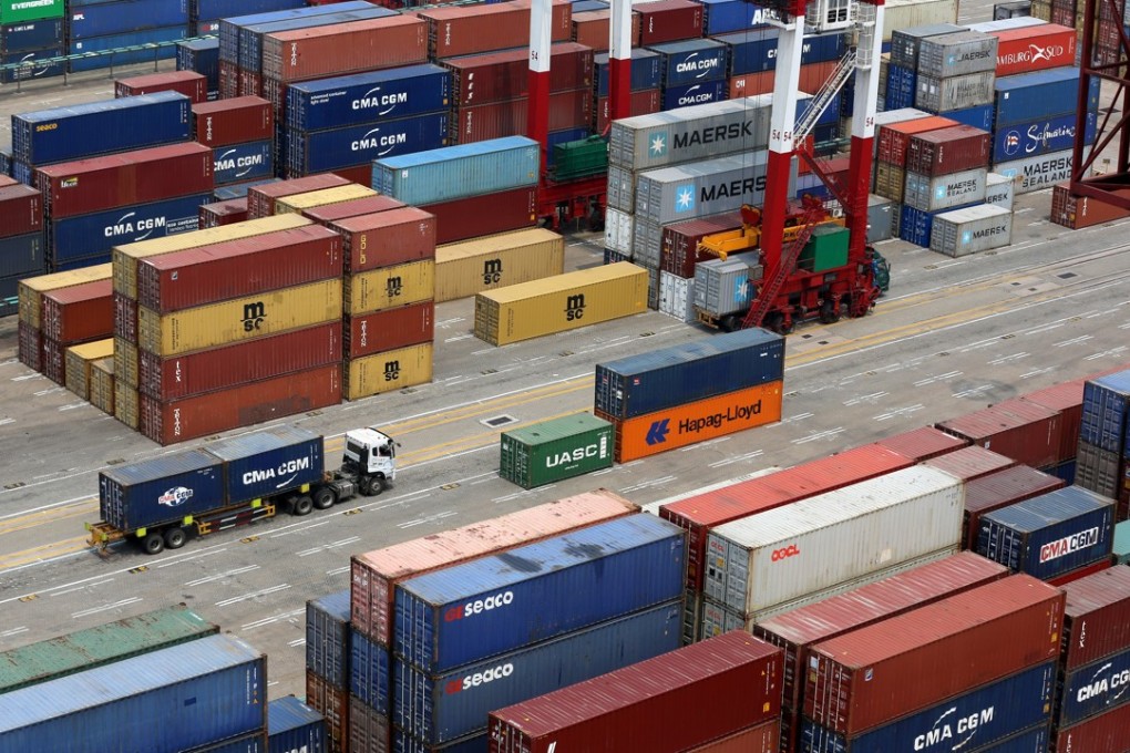 Trucks transport containers at the Port of Qingdao in Shandong province, in April. The global uncertainty over international trade, fuelled by White House rhetoric and threats of trade wars and tariff increases, may have suppressed enthusiasm to invest overseas. Photo: EPA-EFE