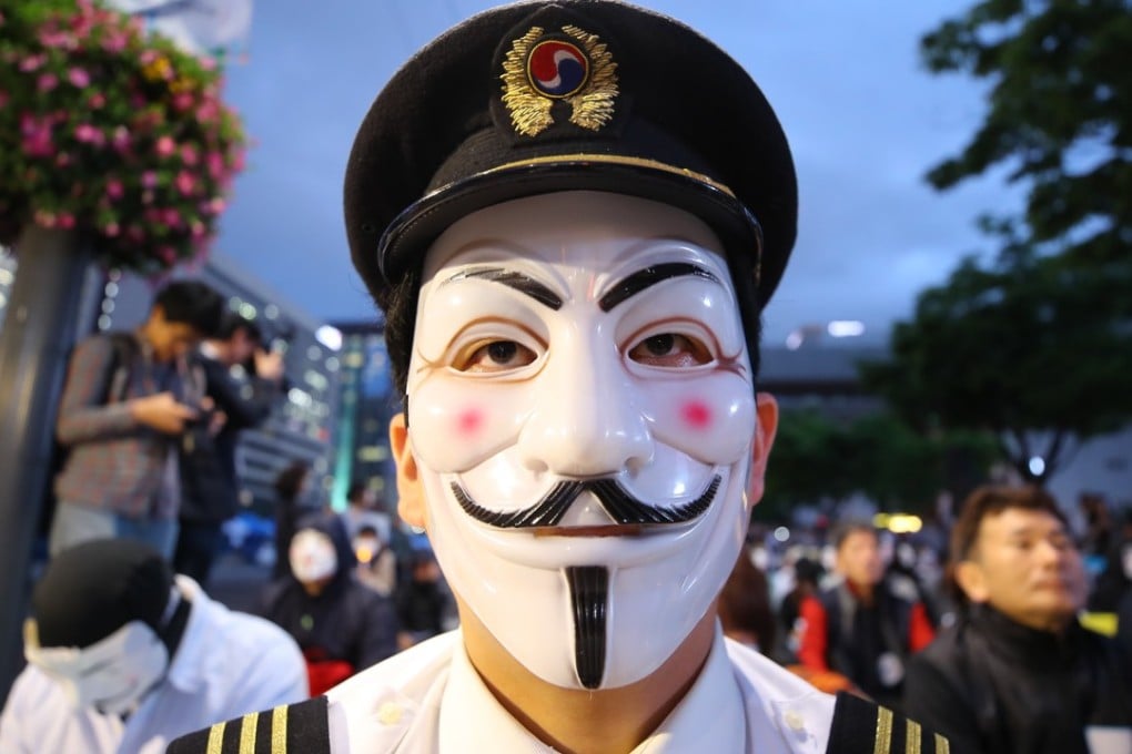 A pilot for Korean Air at a protest against the family that owns the airline. Photo: EPA