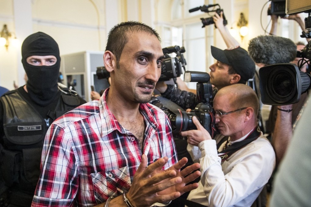 Prime suspect L.S. of Afghanistan attends a court hearing at Kecskemet Court of Justice in Kecskemet, 85km southeast of Budapest, Hungary, on Thursday. He was jailed for his role in the deaths of 71 migrants who suffocated to death in the back of a refrigerated truck found on an Austrian highway. Photo: AP