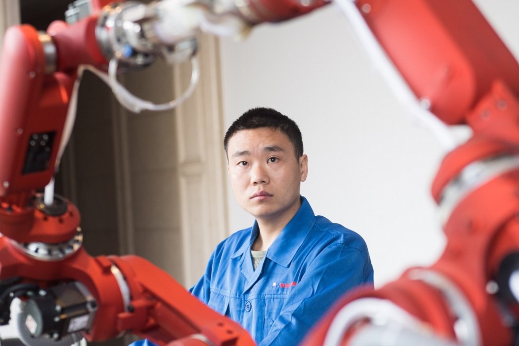 A technician from Hsoar Group debugs a robot in Rui'an city in Zhejiang province in January. If the Greater Bay Area aims to compete with Silicon Valley, it must attract tech talent from around China and oversaes. Photo: Xinhua