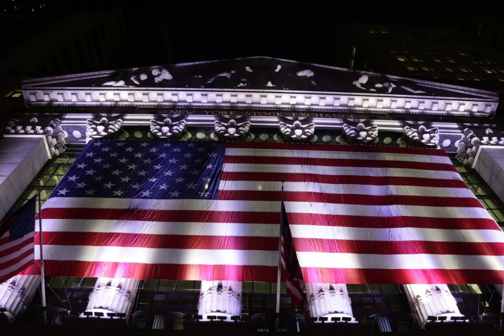 An American flag hangs on the front of the New York Stock Exchange in February 2017. Photo: AP