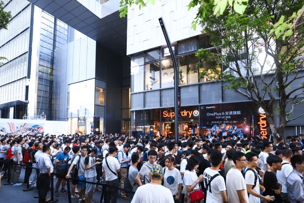 Crowds of people gather outside a pop-up shop to buy the latest OnePlus smartphone. Photo: Handout