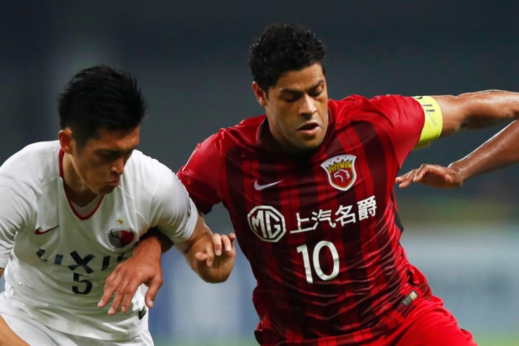 Shanghai SIPG’s Hulk (right) fights for the ball in the AFC Champions League. Photo: AFP
