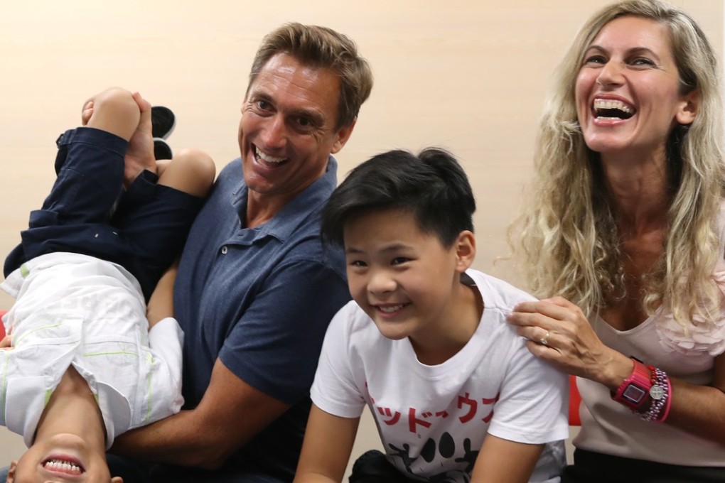 The Colbrans (from left) Ryan, six, Craig, Luke, 11, and Elisa are one happy family and a success story from the work of the Social Welfare Department. Photo: Edward Wong