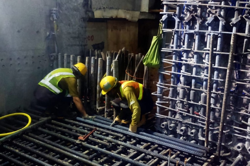 Workers in uniforms and safety helmets of Leighton Contractors (Asia), the main contractor involved in the platform scandal of Sha Tin-Central rail link, are seen apparently cutting steel bars that formed the platform framework of the Hung Hom station for Hong Kong’s most expensive rail project. Photo: SCMP