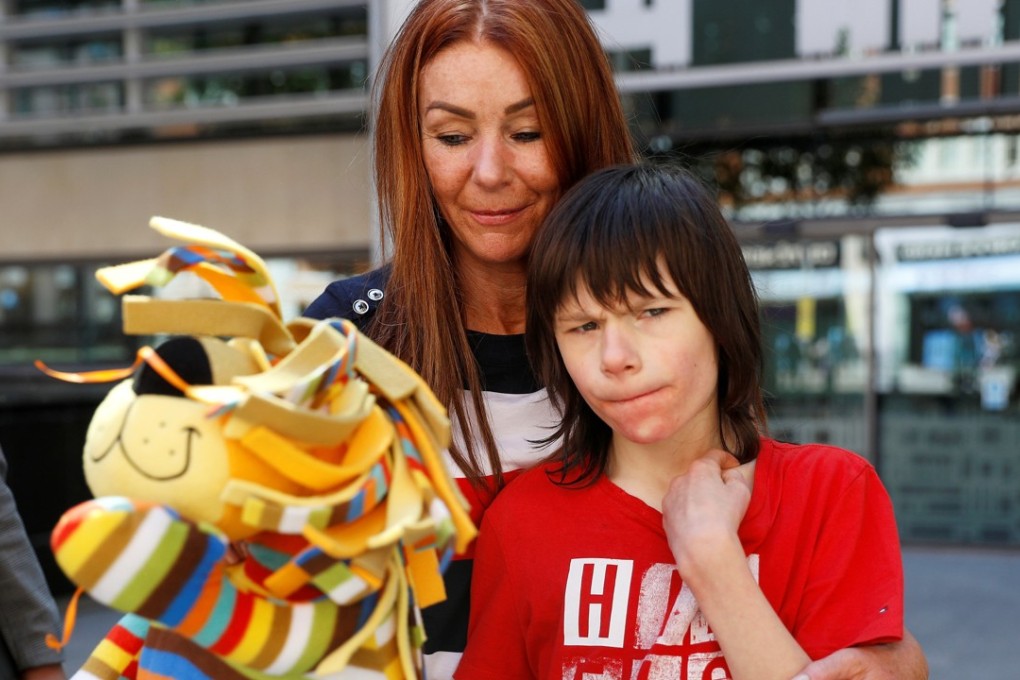 Charlotte Caldwell and her son Billy outside the Home Office in London on June 11, 2018. Photo: Reuters