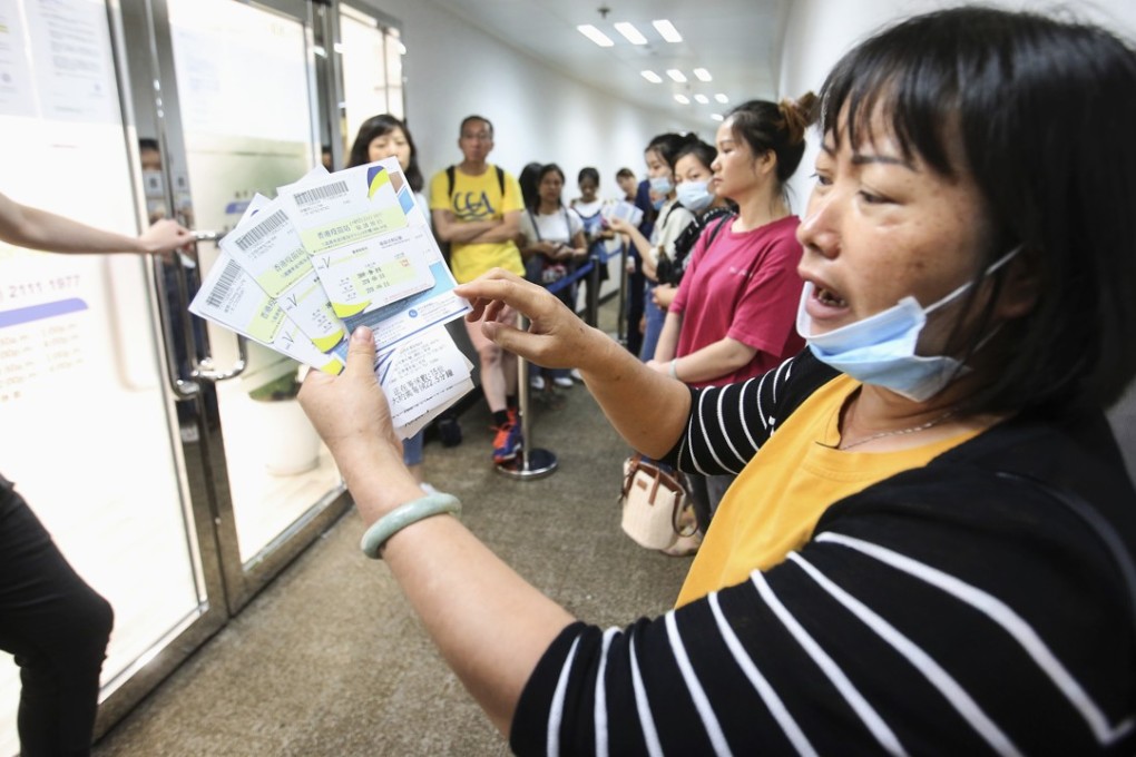 Protesters gather outside a medical centre in Tsim Sha Tsui on Friday, unhappy about their HPV vaccines. Photo: SCMP