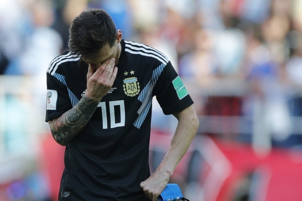 Lionel Messi covers his face during the group D match between Argentina and Iceland at the 2018 World Cup in Russia. Photo: AP
