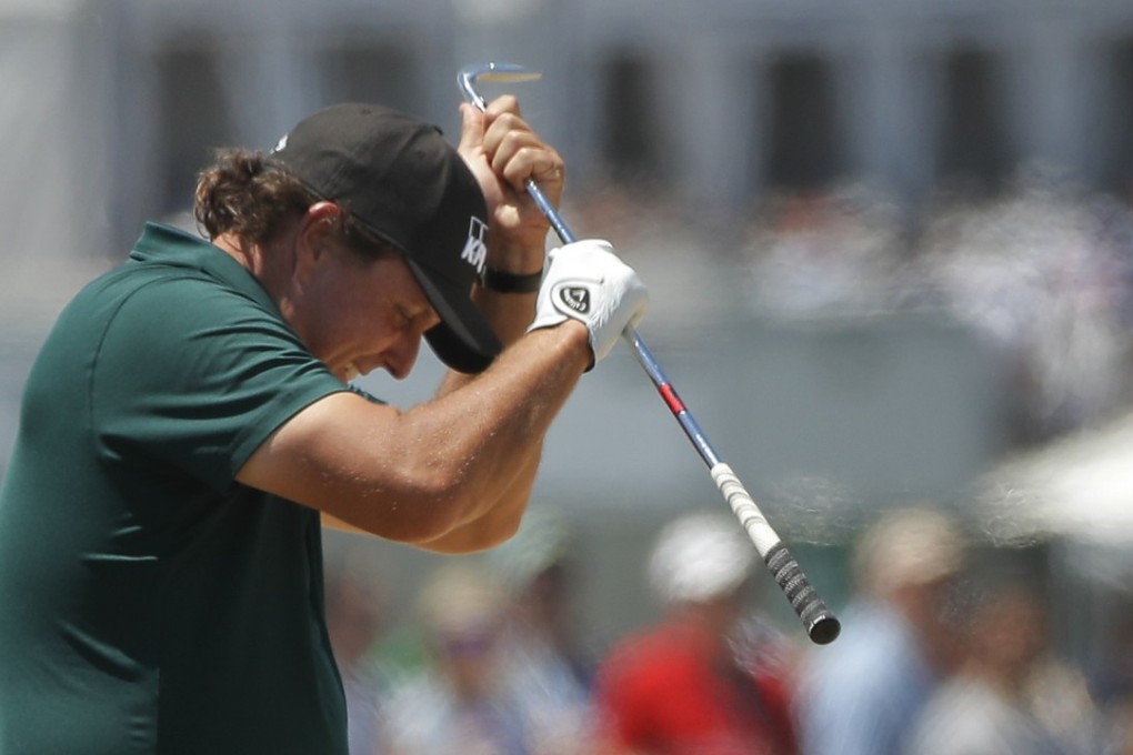 A frustrated Phil Mickelson reacts to a shot from the fescue on the fifth hole during the third round of the US Open in Southampton, New York. Photo: AP