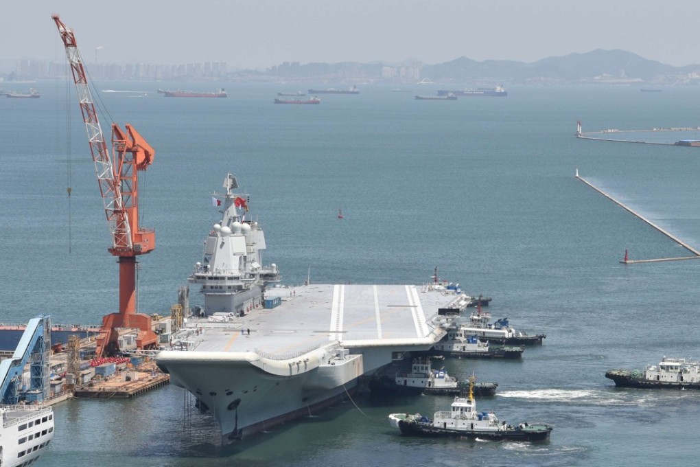 China’s first domestically developed aircraft carrier is seen at a port in Dalian, Liaoning province, after completing its first sea trials in May. Photo: Reuters
