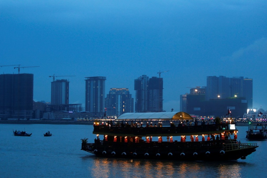 A boat passes buildings under construction on Diamond Island in Phnom Penh, where the Cambodian government initiated measures to increase the supply of condominiums by 20 per cent to 12,000. Photo: Reuters