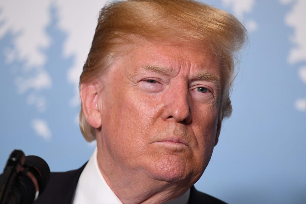 US President Donald Trump listens questions from reporters during a press conference at the G7 Summit on June 9, 2018, in La Malbaie, Quebec, Canada. / AFP PHOTO / SAUL LOEB