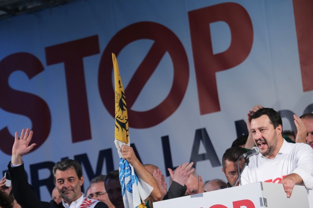 Matteo Salvini speaks during an anti-immigration protest in October 2014 in Milan. Long-simmering tensions over the influx of migrants from outside Europe have come to a head in Italy, with the right-wing League allying with the leftist Five Star Movement to rein in immigration and resist pension reforms, with Salvini serving as minister of the interior. Photo: AFP