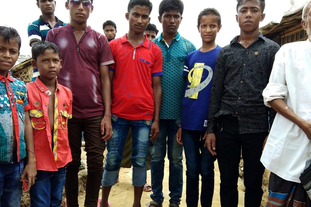 Young Rohingya men show off their new jeans. Photo: Washington Post