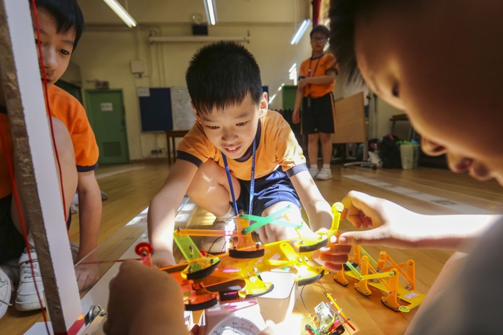 Children line up their robots for a race at the Chan Lui Chung Tak Memorial School in Yau Tong, May 25. Hong Kong is often called upon to speed up the adoption of technology and to prepare children for the digital revolution, or the “fourth industrial revolution”, a future dominated by automation. Photo: Xiaomei Chen