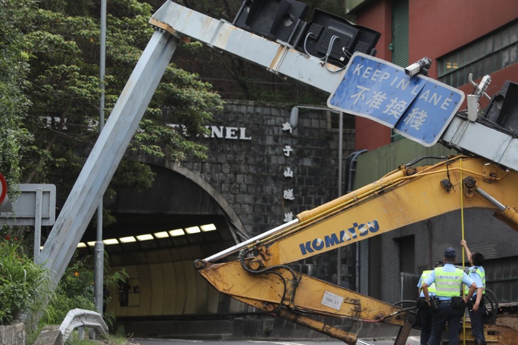 A gantry collapsed after being rammed by an excavator at the Kowloon exit of Lion Rock Tunnel on Tuesday. Photo: Sam Tsang
