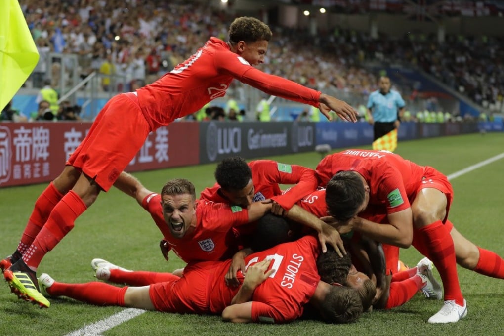 England's team celebrate after scoring their side's opening goal against Tunisia during the group G match at the Volgograd Arena in Volgograd, Russia, on Monday. Photo: AP