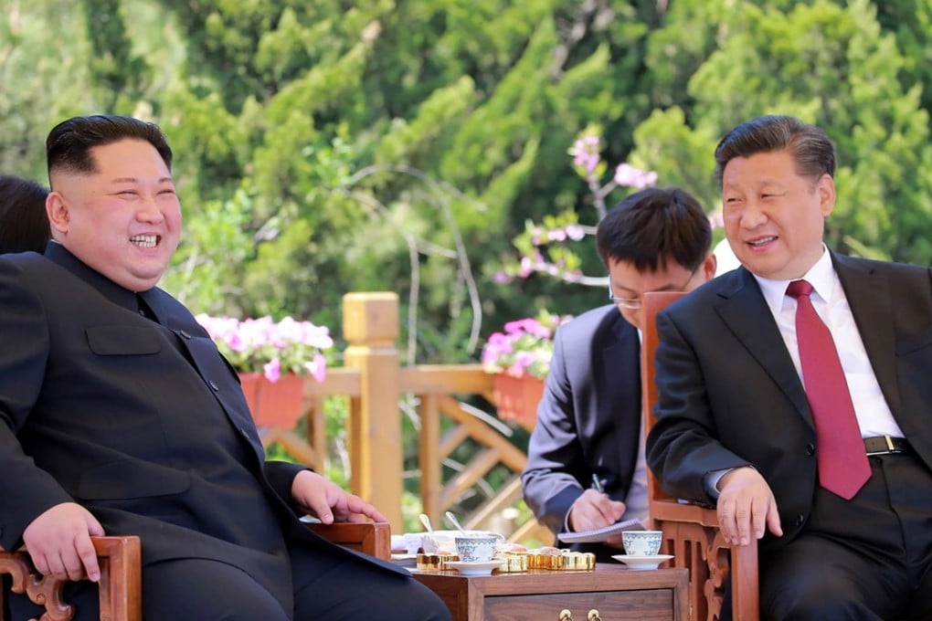 North Korean leader Kim Jong-un (left) and China’s President Xi Jinping meet in the Chinese city of Dalian in May. Photo: AFP/KCNA