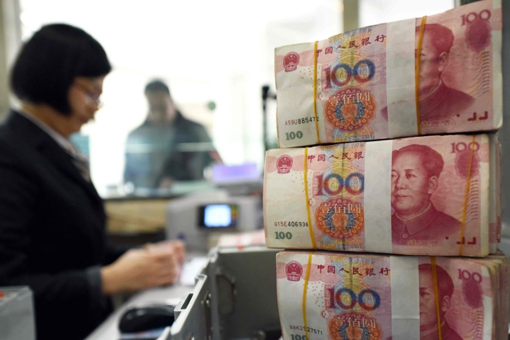 The offshore yuan traded at 6.4795 against the US dollar on Tuesday, 0.8 per cent cheaper than its onshore counterpart. Photo: AFP