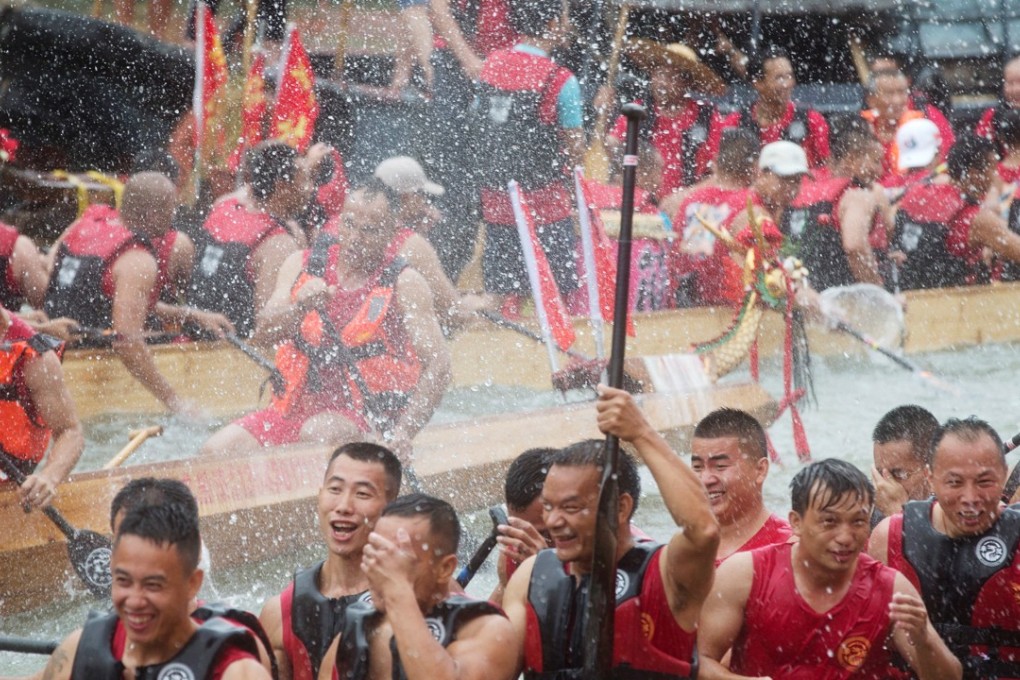 Getting wet on the water is all part of the fun of China’s annual Dragon Boat festival. Photo: Reuters