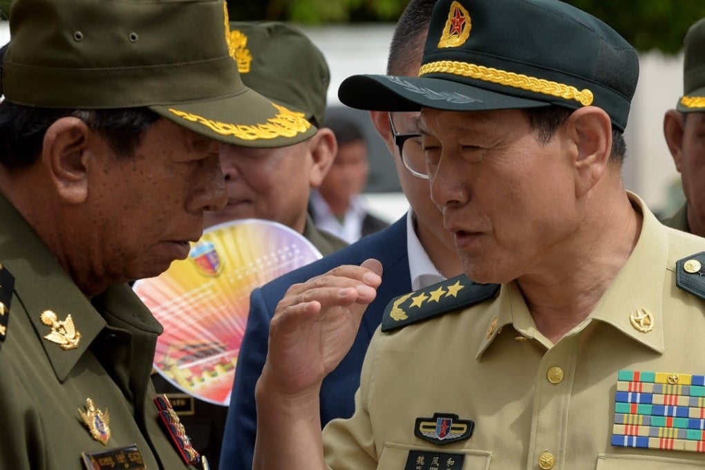 China's defence minister Wei Fenghe (right) speaks to Cambodia's defence minister Tea Banh during a visit to a military exhibition in Phnom Penh. Photo: AFP