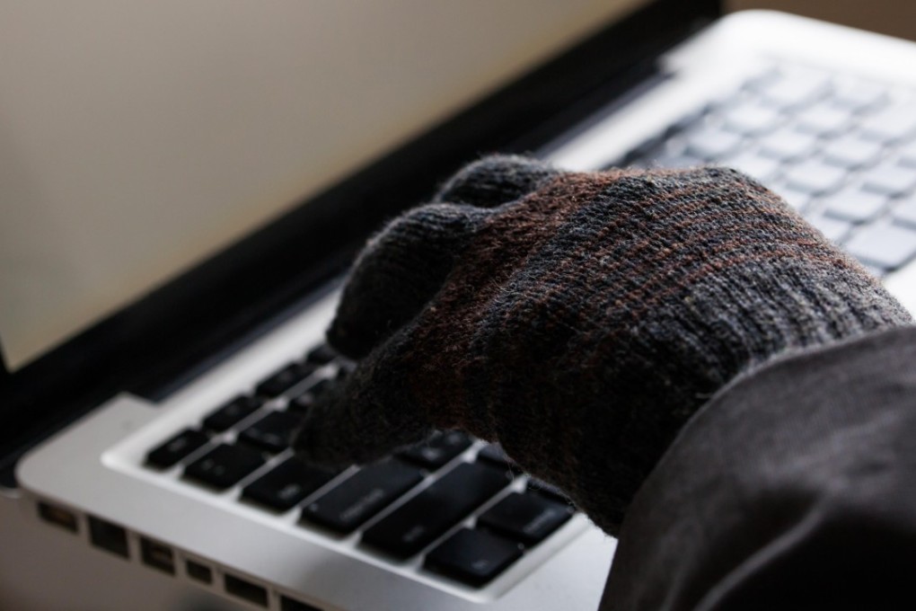 A gloved computer user. Photo: Alamy