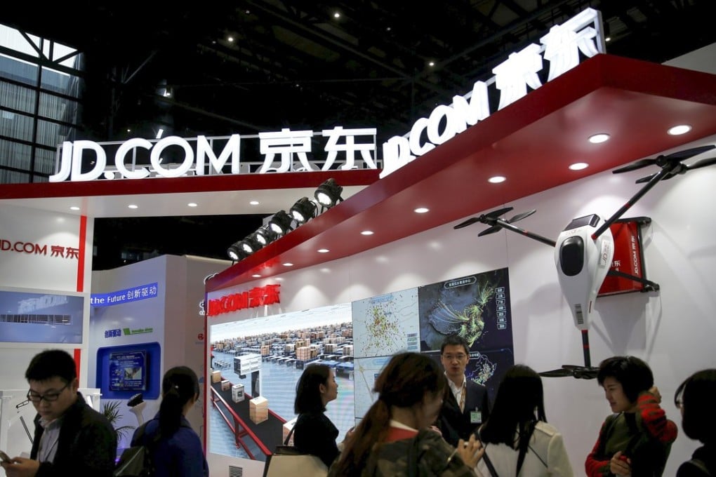 FILE PHOTO: A sign of China's e-commerce company JD.com is seen during the third annual World Internet Conference in Wuzhen town of Jiaxing, Zhejiang province, China November 16, 2016. REUTERS/Aly Song/