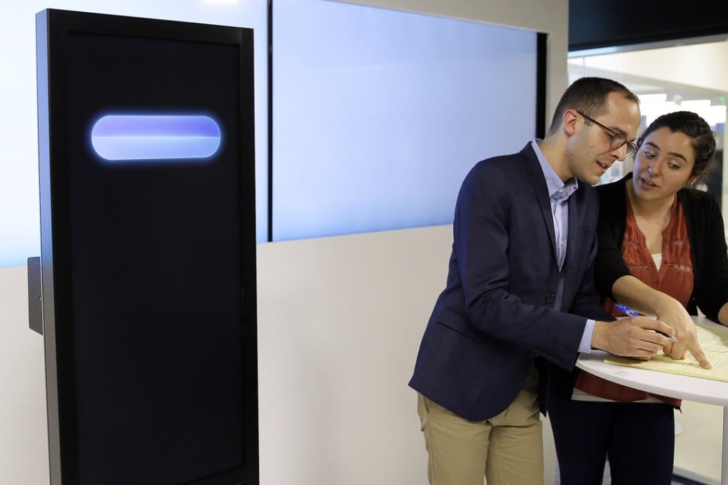 Dan Zafrir and Noa Ovadia prepare for their debate against the IBM Project Debater on Monday, June 18, 2018 in San Francisco. Photo: AP