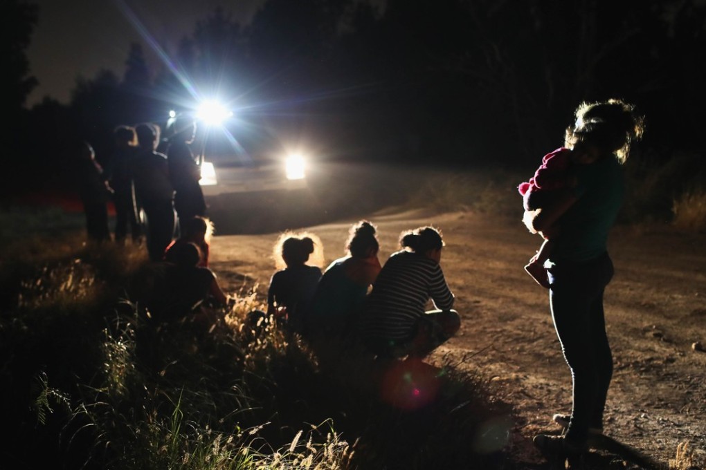 US Border Patrol agents arrive to detain a group of Central American asylum seekers near the US-Mexico border on June 12 in McAllen, Texas. Photo: Agence France-Presse