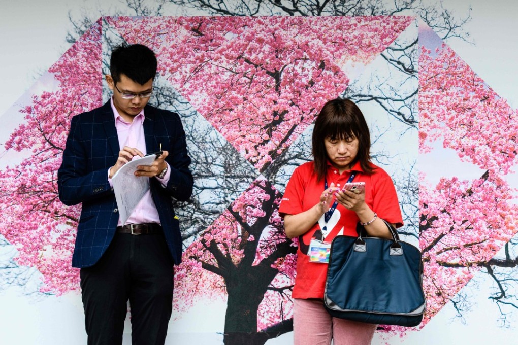 Hong Kong has one of the world’s highest mobile phone usage rates at 248 per cent, according to government data released in February. Photo: AFP