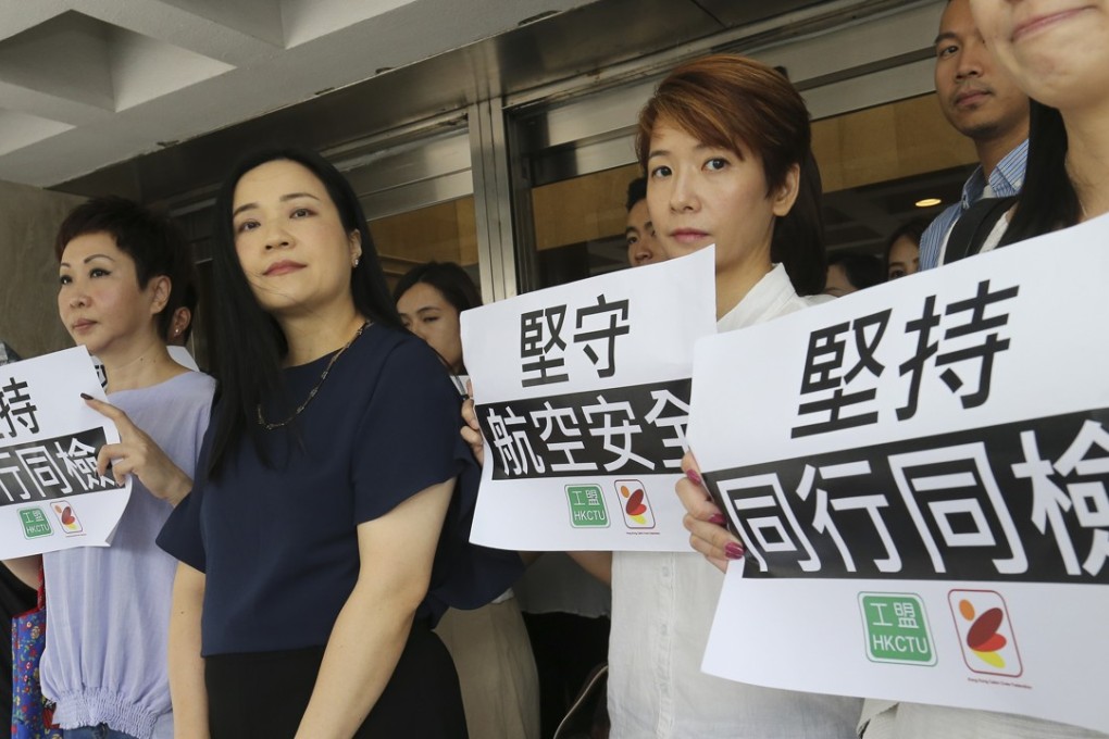 Carol Ng Man-yee (second from left), General Secretary of the Hong Kong Cabin Crew Federation, attended the hearing with other members and told reporters they had not been informed of the rule change. Photo: Dickson Lee