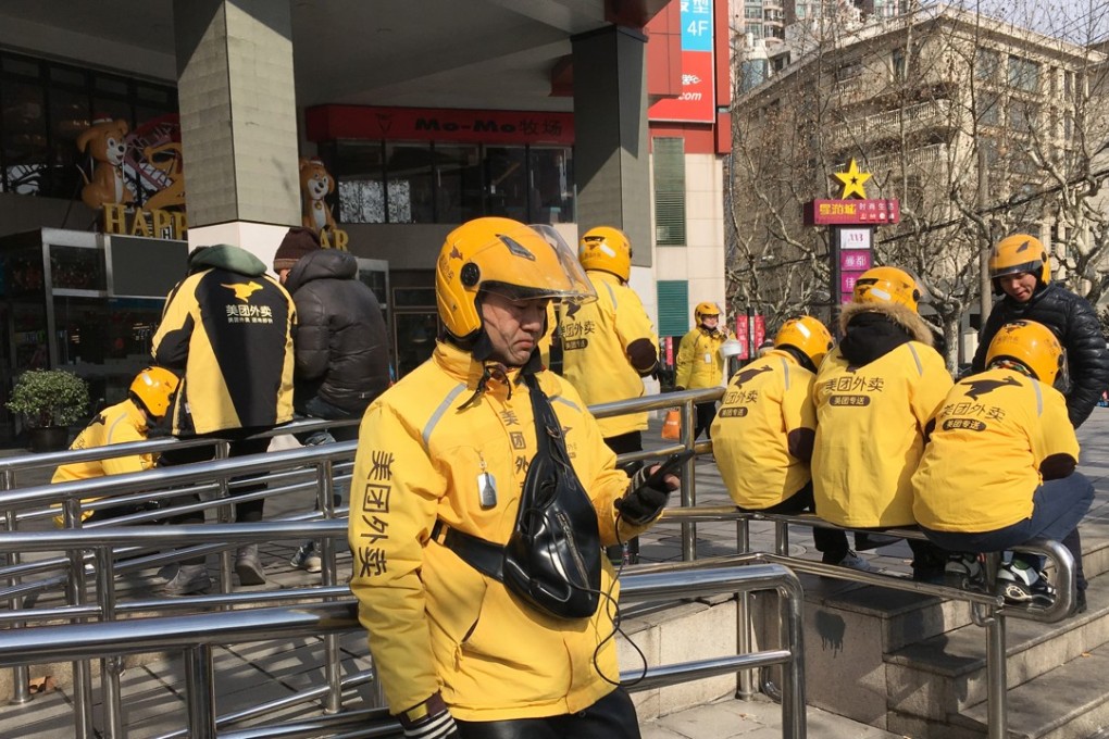 Delivery drivers of Meituan Takeaway wait for orders. Photo: SCMP