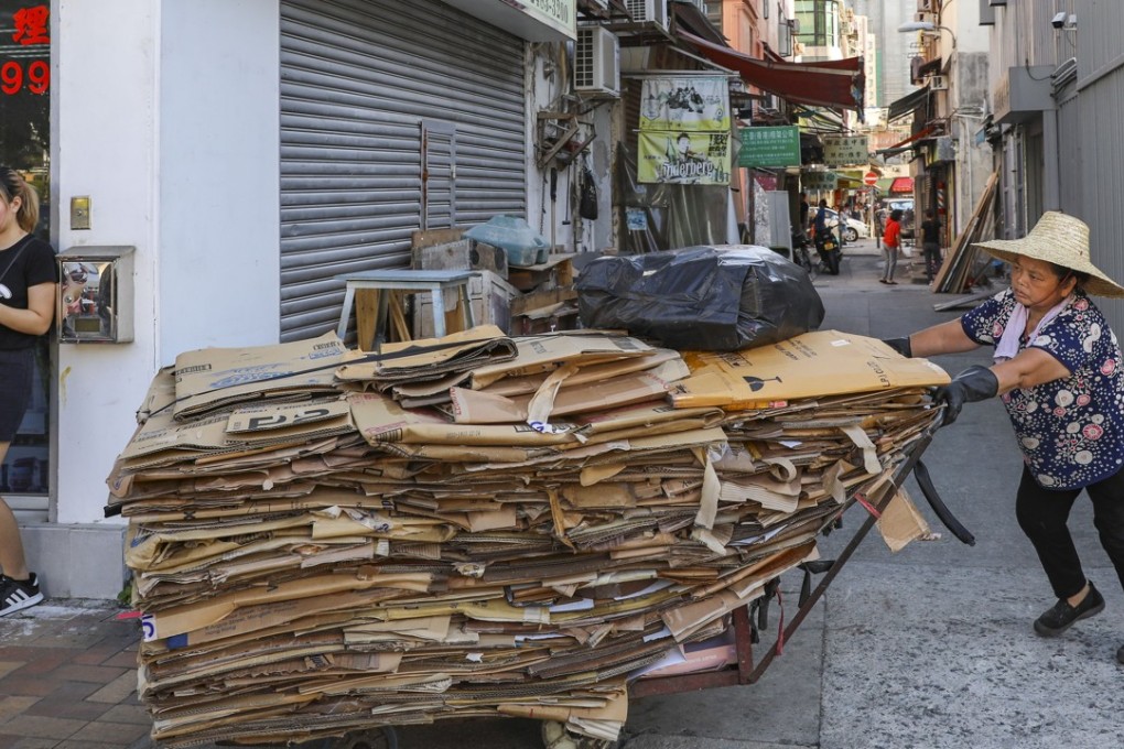 An elderly woman collects cardboard on the streets in Sheung Shui. Photo: Sam Tsang