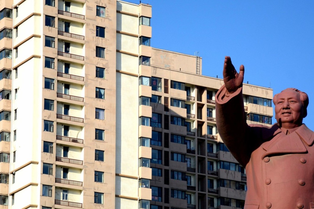 A statue of former Chinese leader Mao Zedong in front of a residential building in Dandong, the border city which handles the lion’s share of bilateral trade flows between China and North Korea. Photo: Reuters