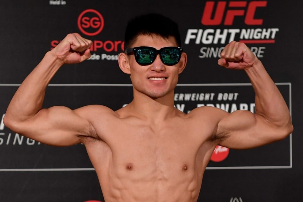 Song Yadong of China poses on the scale during the UFC Fight Night weigh-in at the Mandarin Oriental in Singapore. Photo: Jeff Bottari/Zuffa LLC via Getty Images