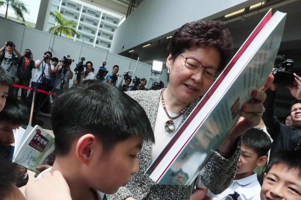 Chief Executive Carrie Lam tours the Leisure and Cultural Services Department's “My Pop-up Library” after the opening ceremony for 2018 World Book Day at SKH St Mary's Church Mok Hing Yiu College, in Sham Shui Po. Photo: Jonathan Wong