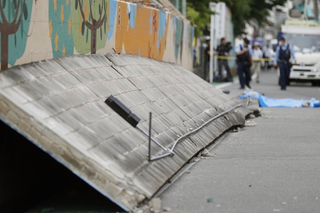 The fallen wall at the school in Takatsuki, Osaka. Photo: Kyodo