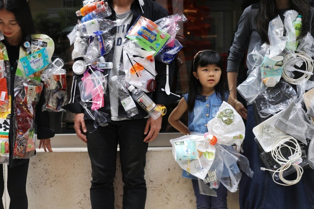 Protesters mark International Earth Day by wearing jackets of plastic waste on April 22. Hong Kong should focus on reducing waste at source instead of seeing incinerators as a solution. Photo: Sam Tsang