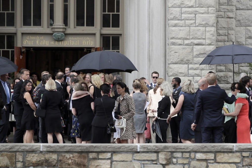 Mourners for Kate Spade gather outside Our Lady of Perpetual Help Catholic Church in Kansas City, Missouri, on Thursday. Photo: AP