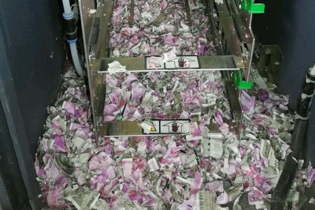 Shredded 2,000 and 500 rupee notes in the cash machine in Tinsukia in India’s northeastern Assam state. Photo: AFP