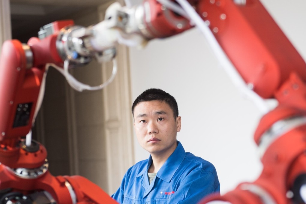 A technician from Rui'an Hsoar Group debugs a robot in Rui'an City in China's Zhejiang province. China has set ambitious technological targets as part of its “Made in China 2025” campaign, but this has led to allegations of unfair competition at home, theft of intellectual property and strong-arming foreign companies in China into sharing knowledge with Chinese entities. Photo: Xinhua
