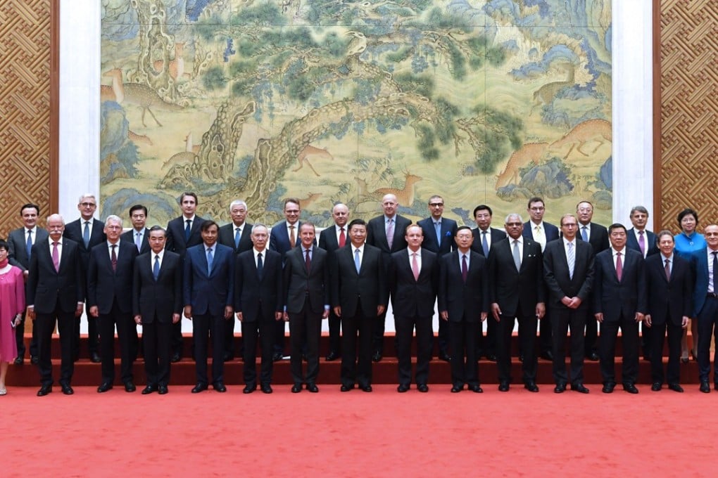 President Xi Jinping (centre) with executives from multinational companies attending a round-table summit of the Global CEO Council in Beijing on Thursday. Photo: Xinhua