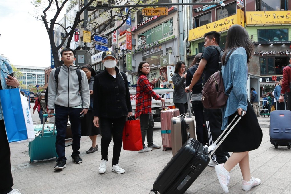 Chinese tourists on Myeongdong Street in downtown Seoul on 13 April 2018. According to the finance ministry, the number of Chinese tourists visiting the country showed a 13.3 per cent increase on-year in March. Photo: EPA-EFE