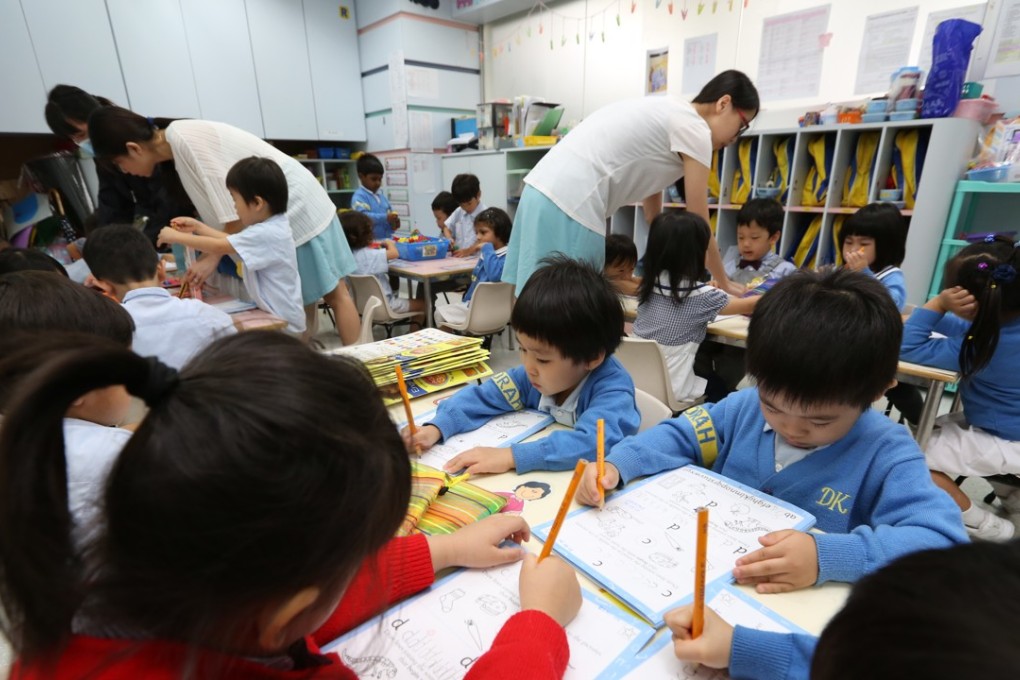 Children practise writing at a preschool in Hung Hom in November 2014. Preschool interviews are becoming increasingly onerous. Photo: Nora Tam