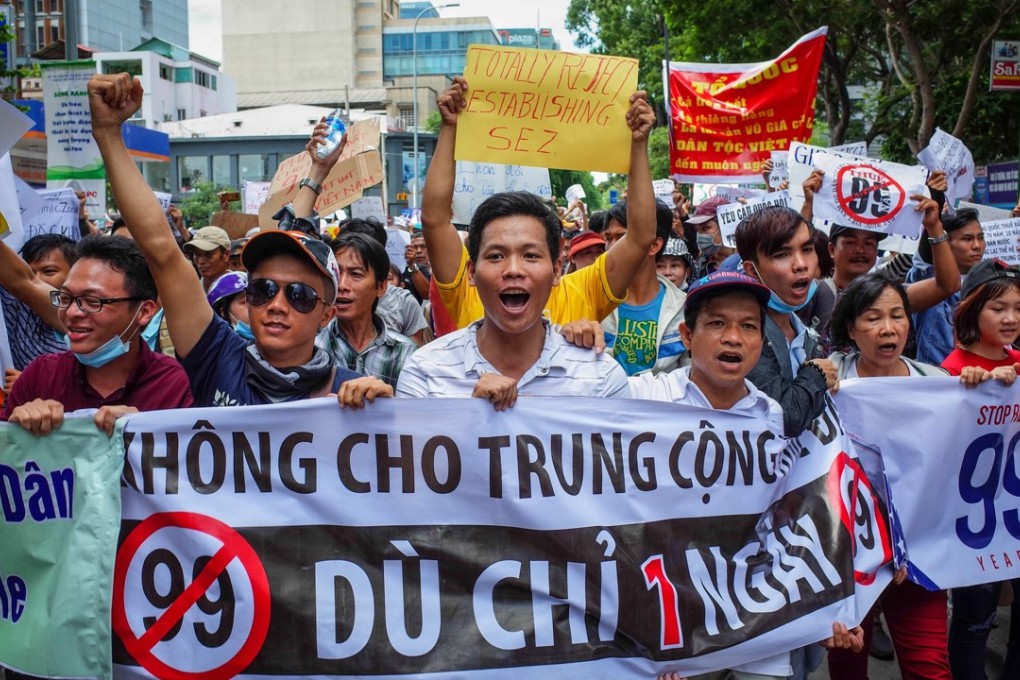 Vietnamese protesters shout slogans against a proposal to grant foreign companies lengthy land leases during a demonstration in Ho Chi Minh City on June 10, 2018. Photo: AFP