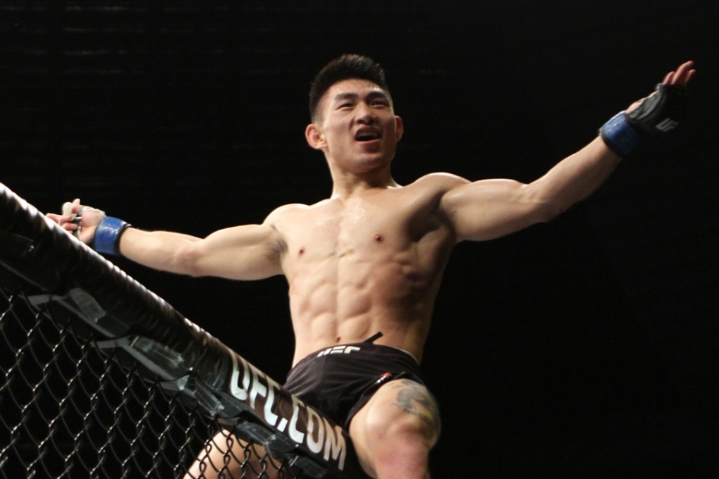 Song Yadong celebrates victory at UFC Singapore. Photos: Lee Li/Asia MMA