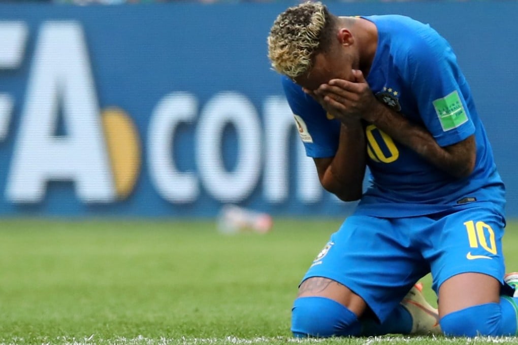 Neymar falls to the pitch in tears after the final whistle. Photo: EPA