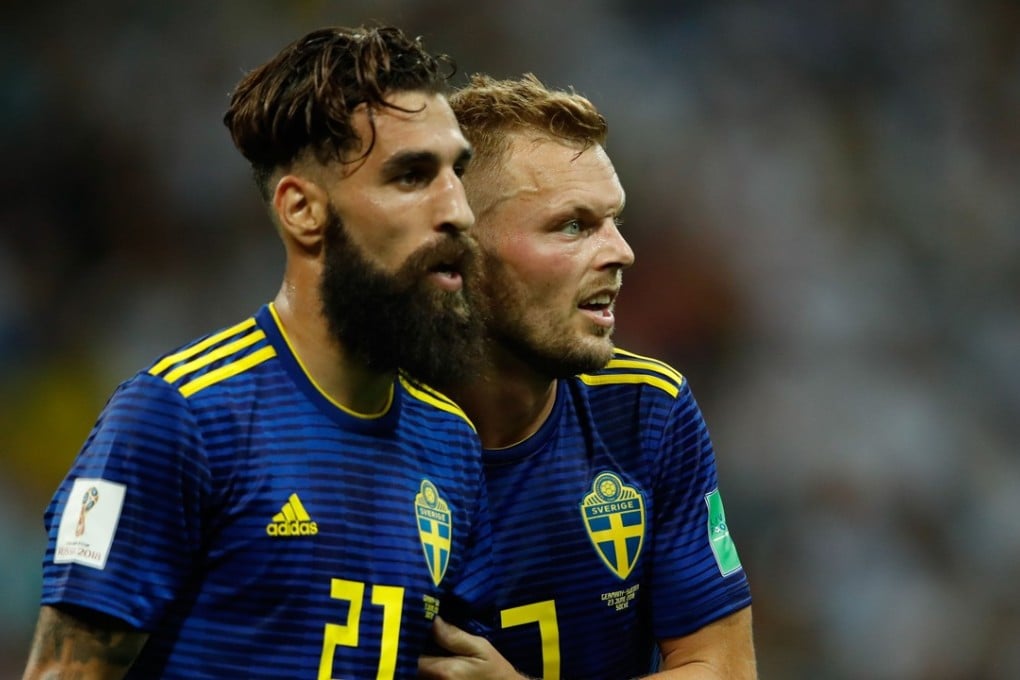 Sweden's midfielder Jimmy Durmaz (L) and Sebastian Larsson react at the end of the loss to Germany. Photo: AFP