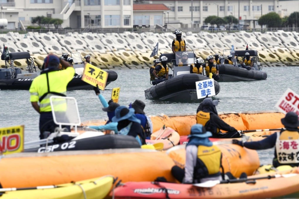 Demonstrators face off against the coastguard off Henoko, Okinawa on June 25, 2018. Photo: Kyodo