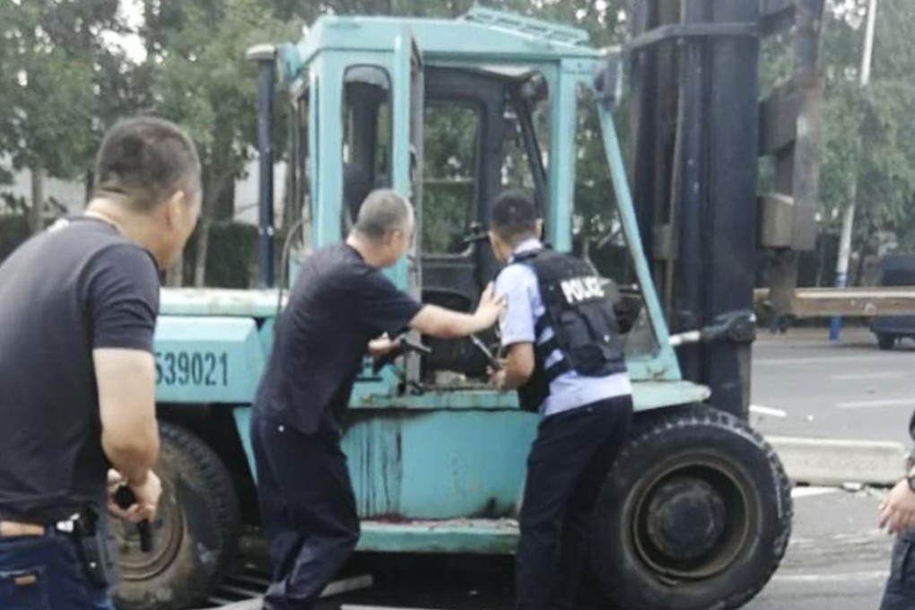 Armed police shot dead the driver of a forklift truck after he went on the rampage through the streets of an east China city. Photo: Weibo